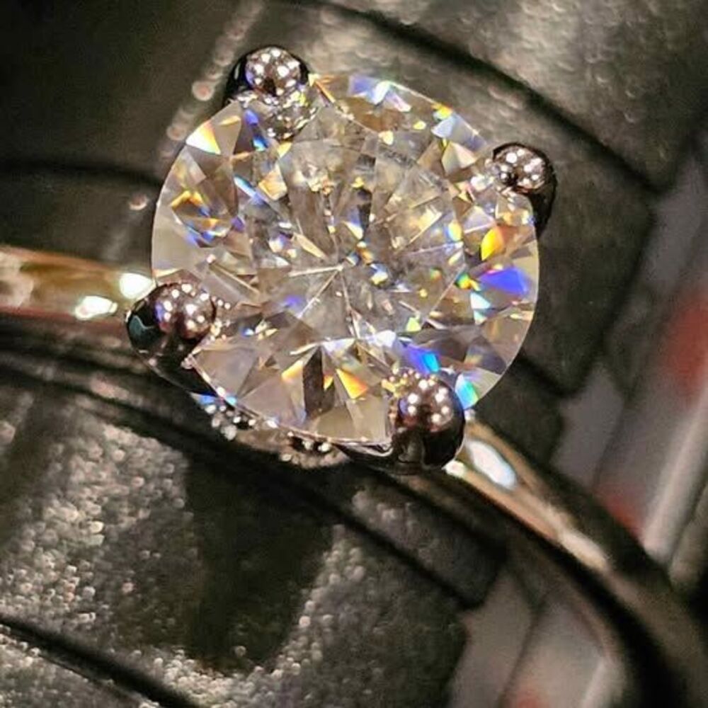 1.08CTW Moissanite Solitaire with Halo setting. Set in 925 Sterling Silver. Sz 7